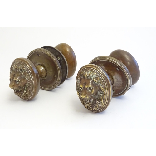 1256 - Two pairs of late 19th / early 20thC large brass door knobs / handles / door furniture with cast lio... 