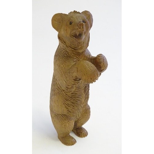 1267 - A Victorian black forest style carved wooden model of a bear standing. Approx. 7 1/2