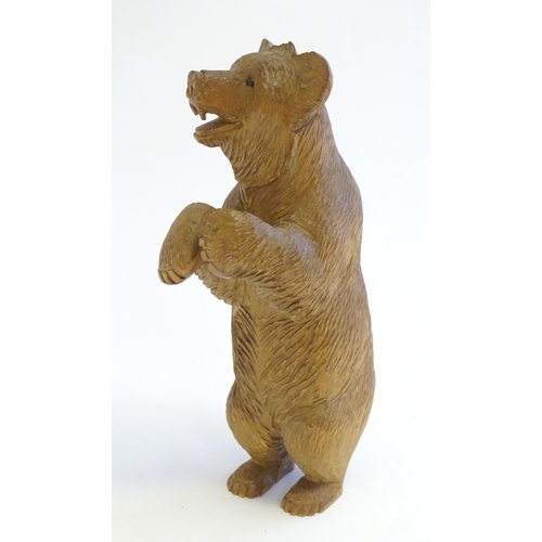 1267 - A Victorian black forest style carved wooden model of a bear standing. Approx. 7 1/2