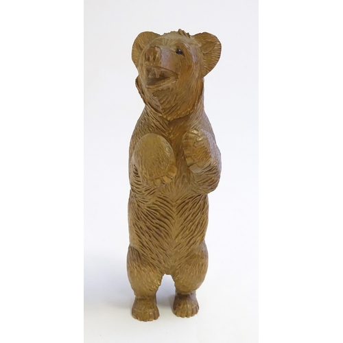 1267 - A Victorian black forest style carved wooden model of a bear standing. Approx. 7 1/2