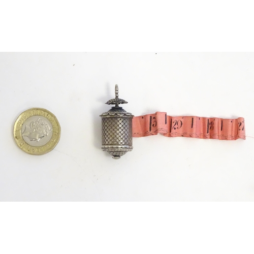 1279 - A Victorian white metal sewing tape measure. Approx. 1 1/2