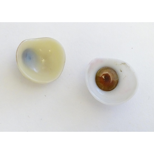 1295 - Two 19thC prosthetic glass human eyes with brown irises. Largest approx. 1