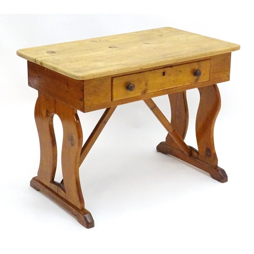 2081 - A 19thC pine Victorian table with a rectangular top above single long drawer with turned wooden hand... 