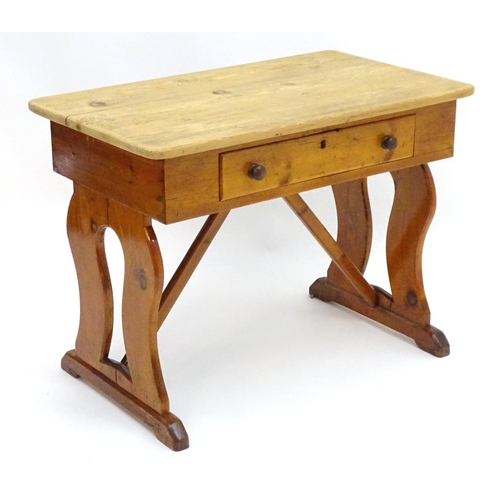 2081 - A 19thC pine Victorian table with a rectangular top above single long drawer with turned wooden hand... 