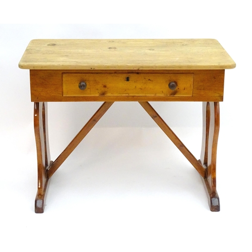 2081 - A 19thC pine Victorian table with a rectangular top above single long drawer with turned wooden hand... 