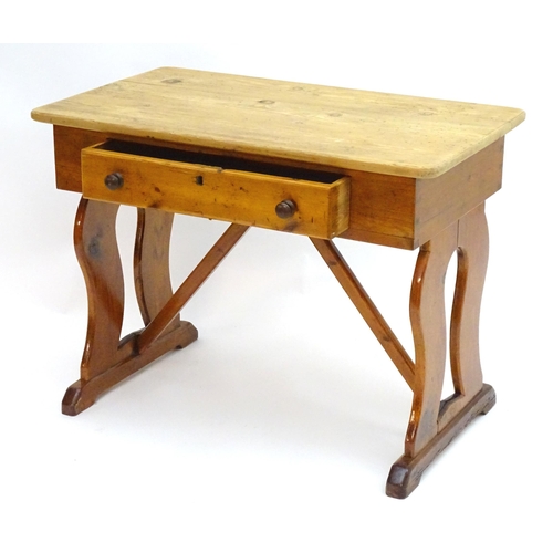 2081 - A 19thC pine Victorian table with a rectangular top above single long drawer with turned wooden hand... 