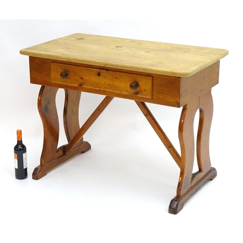 2081 - A 19thC pine Victorian table with a rectangular top above single long drawer with turned wooden hand... 