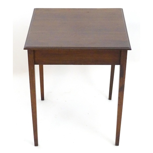 2086 - An early 20thC mahogany side table with a single short drawer with ring pull handles and four taperi... 