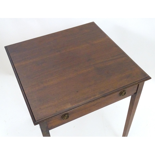 2086 - An early 20thC mahogany side table with a single short drawer with ring pull handles and four taperi... 