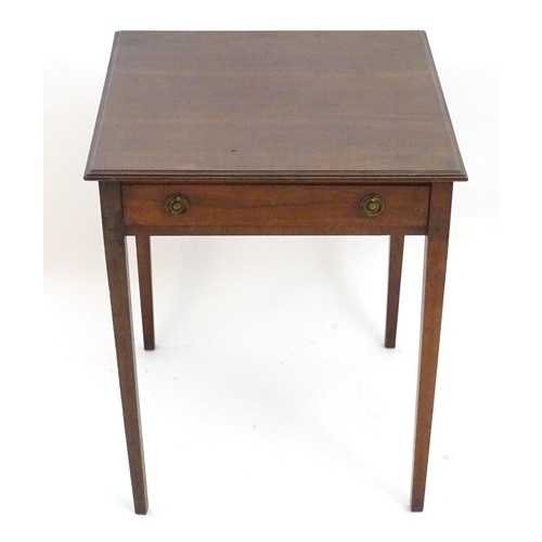 2086 - An early 20thC mahogany side table with a single short drawer with ring pull handles and four taperi... 