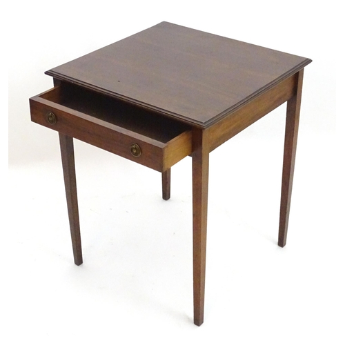 2086 - An early 20thC mahogany side table with a single short drawer with ring pull handles and four taperi... 