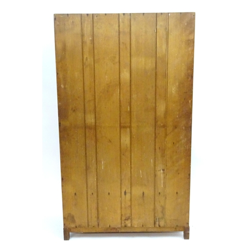 2089 - An early 20thC walnut 'Maple & Co' wardrobe with two doors opening to show hooks and a hanging rail,... 