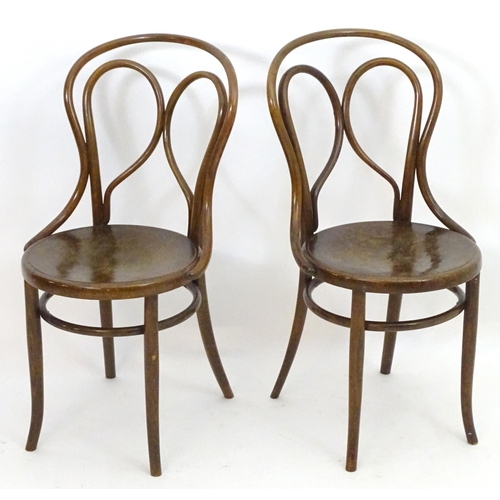 2108 - A pair of Thonet style Bentwood chairs with double bowed back rests and anthemion embossed seats. 18... 