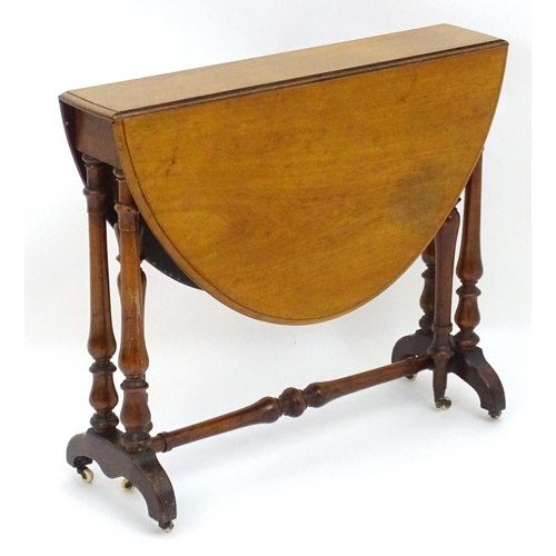 2114 - A mid / late 19thC walnut Sutherland table with drop flaps, turned legs and a tapering turned stretc... 