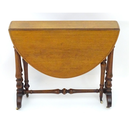 2114 - A mid / late 19thC walnut Sutherland table with drop flaps, turned legs and a tapering turned stretc... 