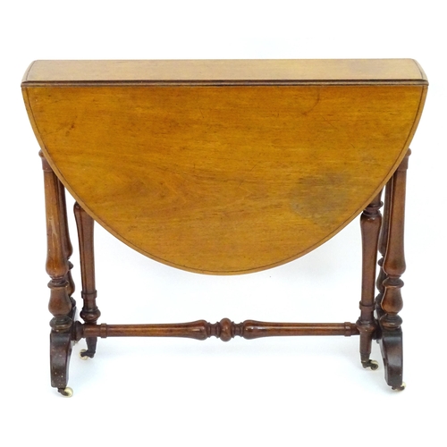 2114 - A mid / late 19thC walnut Sutherland table with drop flaps, turned legs and a tapering turned stretc... 