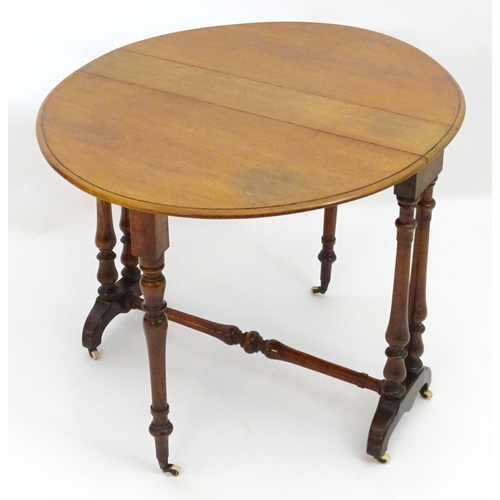 2114 - A mid / late 19thC walnut Sutherland table with drop flaps, turned legs and a tapering turned stretc... 