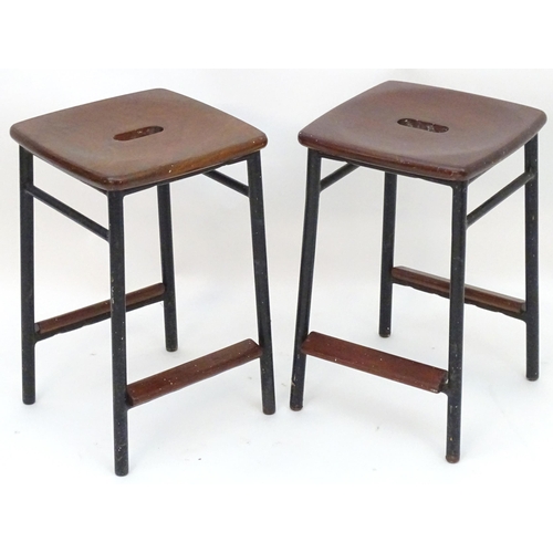 2208 - Vintage Retro, Mid-century: a pair of mahogany stools with black painted steel bases, each 20