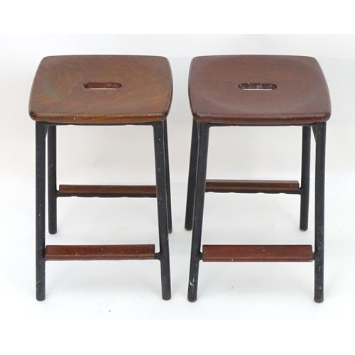 2208 - Vintage Retro, Mid-century: a pair of mahogany stools with black painted steel bases, each 20