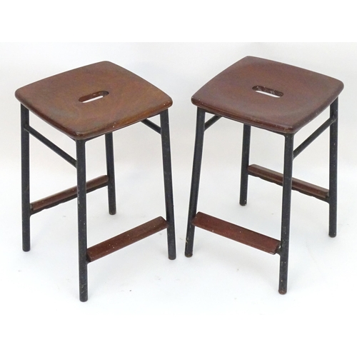 2208 - Vintage Retro, Mid-century: a pair of mahogany stools with black painted steel bases, each 20