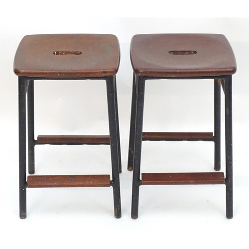 2208 - Vintage Retro, Mid-century: a pair of mahogany stools with black painted steel bases, each 20