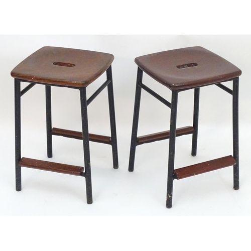 2208 - Vintage Retro, Mid-century: a pair of mahogany stools with black painted steel bases, each 20