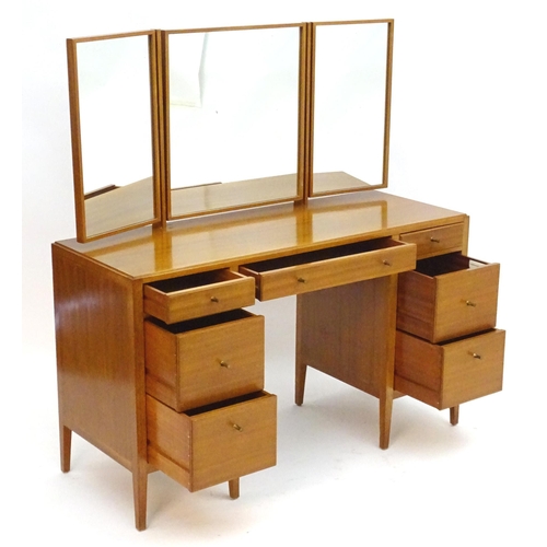 2213 - Vintage Retro, Mid-century: a Loughborough Furniture teak dressing table, with two flights of three ... 