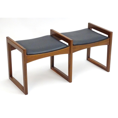 2221 - Vintage Retro, Mid-century: an afrormosia twin stool, the leatherette seats with three quadrille sup... 