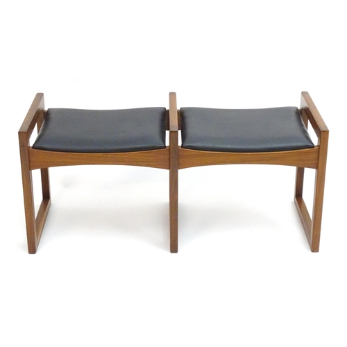 2221 - Vintage Retro, Mid-century: an afrormosia twin stool, the leatherette seats with three quadrille sup... 