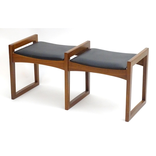 2221 - Vintage Retro, Mid-century: an afrormosia twin stool, the leatherette seats with three quadrille sup... 