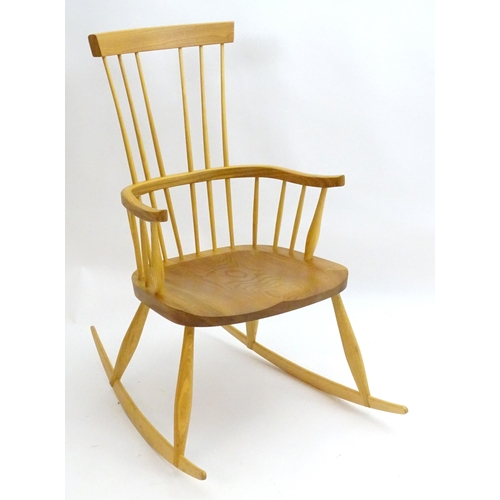 2226 - A 21stC elm Windsor rocking chair, 41 1/2