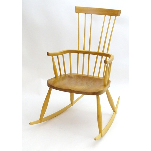 2226 - A 21stC elm Windsor rocking chair, 41 1/2