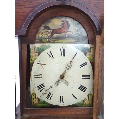 2279 - An oak cased long case clock with 30 hour movement and 12