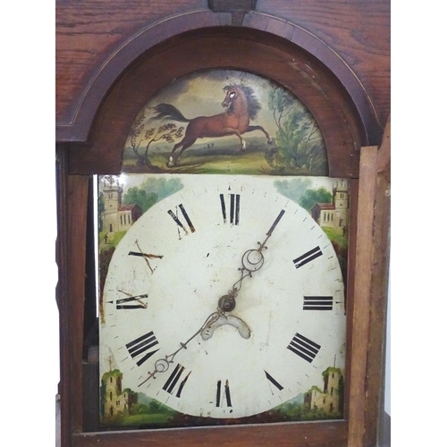 2279 - An oak cased long case clock with 30 hour movement and 12