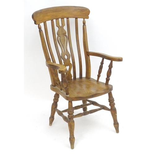 2100A - An early 20thC beech lathe back open armchair with a top rail and pierced central splat above a shap... 