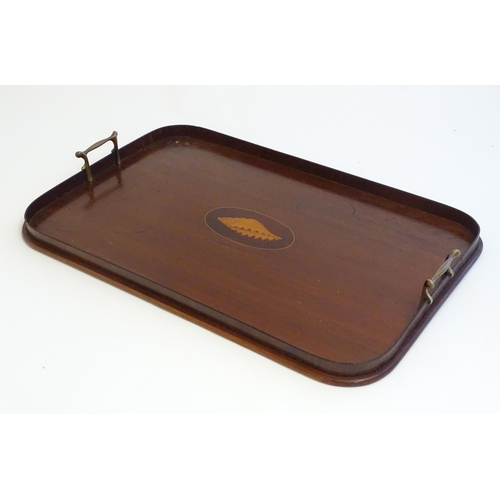 1357 - A late 19th / early 20thC mahogany tray of rectangular form with twin handles and central satinwood ... 