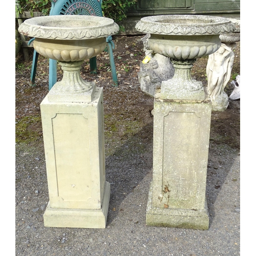 1592 - Garden & Architectural, Salvage: a pair of mid 20thC reconstituted stone classical urns, standing on... 