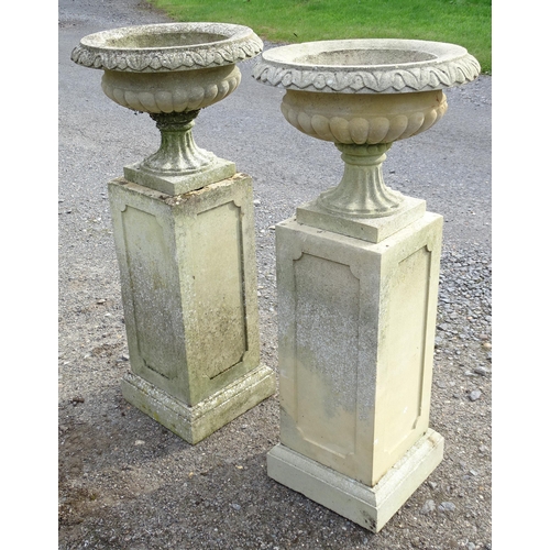 1592 - Garden & Architectural, Salvage: a pair of mid 20thC reconstituted stone classical urns, standing on... 