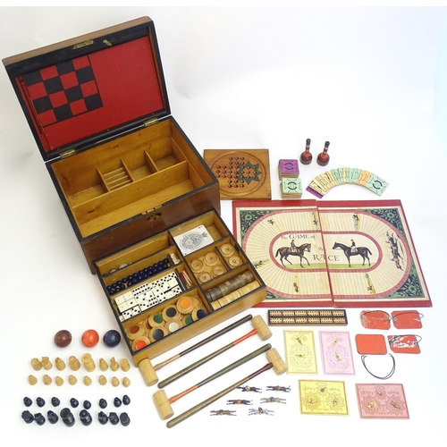 1478 - Toys: A late 19th / early 20thC mahogany games box / compendium with two tier fitted interior contai... 