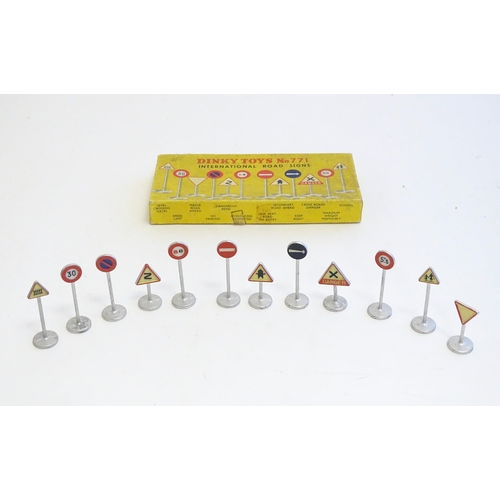 1483 - Toys: A set of Dinky Toys International Road Signs, no. 771. Comprising Level Crossing Gates, Speed ... 