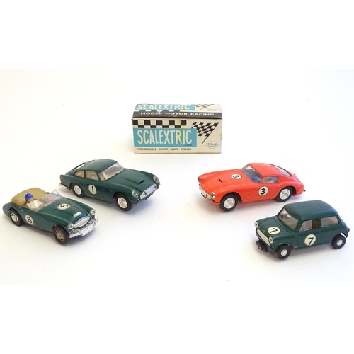 1485 - Toys: Four Tri-ang Scalextric model motor racing cars comprising Austin Healey 3000, Aston Martin DB... 