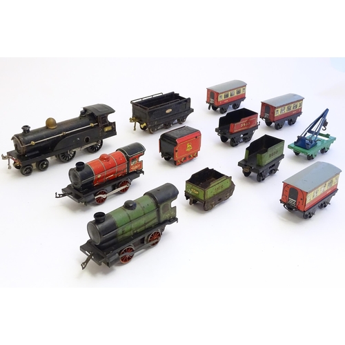 1490 - Toys: A quantity of assorted Hornby Meccano O gauge trains, to include a 4-4-0 clockwork locomotive ... 