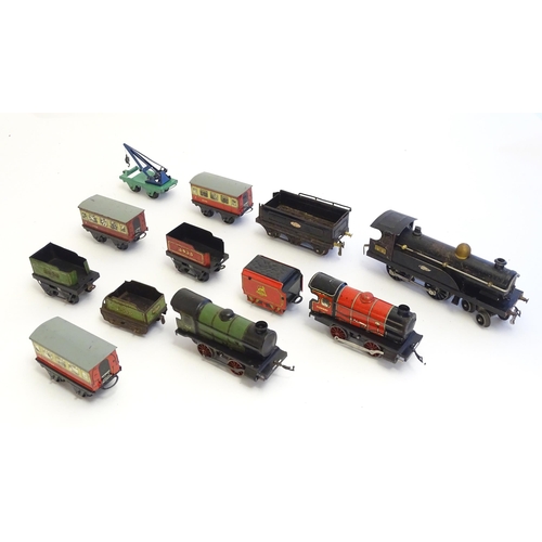 1490 - Toys: A quantity of assorted Hornby Meccano O gauge trains, to include a 4-4-0 clockwork locomotive ... 