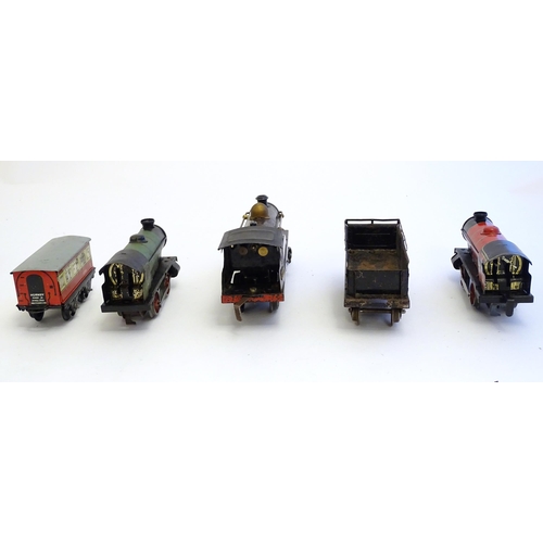 1490 - Toys: A quantity of assorted Hornby Meccano O gauge trains, to include a 4-4-0 clockwork locomotive ... 