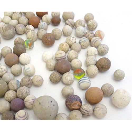 1492 - Toys: A quantity of assorted Victorian marbles to include hand painted ceramic examples, etc.