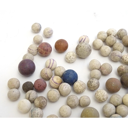 1492 - Toys: A quantity of assorted Victorian marbles to include hand painted ceramic examples, etc.