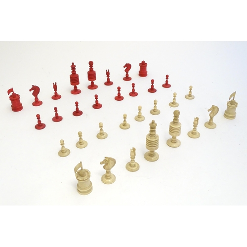 1494 - Toys: A set of 19thC turned and carved bone chess pieces, the largest approx. 3 1/2