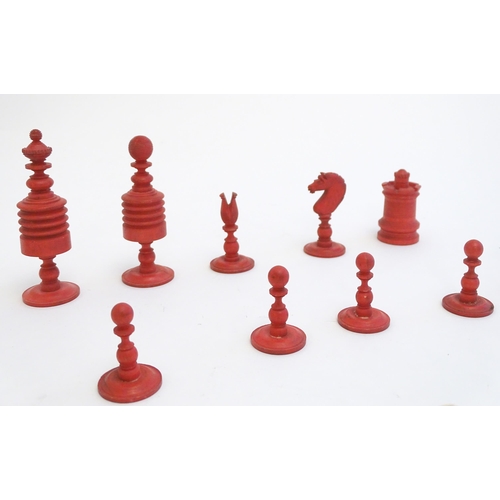 1494 - Toys: A set of 19thC turned and carved bone chess pieces, the largest approx. 3 1/2