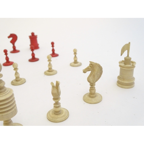 1494 - Toys: A set of 19thC turned and carved bone chess pieces, the largest approx. 3 1/2