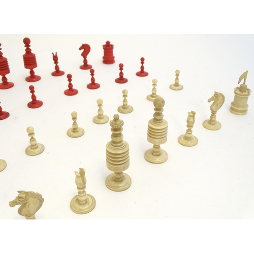 1494 - Toys: A set of 19thC turned and carved bone chess pieces, the largest approx. 3 1/2